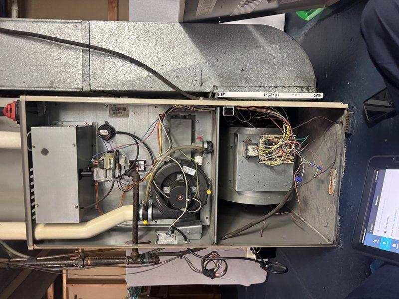 Completed routine maintenance inspection on a 2-year-old residential air conditioning system. Accessed internal components including blower motor assembly, electrical controls, and capacitor connections; verified all wiring connections, contactors, and relays were secure and functioning properly. All systems operating within normal parameters with no issues identified during this preventative maintenance visit.