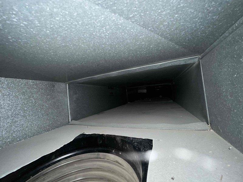 Completed comprehensive duct cleaning service for residential HVAC system with potential scope of up to 30 vents, with initial service covering the first 14 registers. Pre-service inspection revealed visible contamination within the ductwork, including white residue deposits, discoloration, and signs of aging on interior metal surfaces. Performed thorough cleaning of flexible and rigid sheet metal ductwork sections, addressing accumulated debris and surface contamination throughout the system. Documentation photos captured pre-cleaning conditions showing interior duct surfaces with weathering, residue buildup, and corrosion indicators, as well as blower motor assembly connections with proper gasket sealing intact.