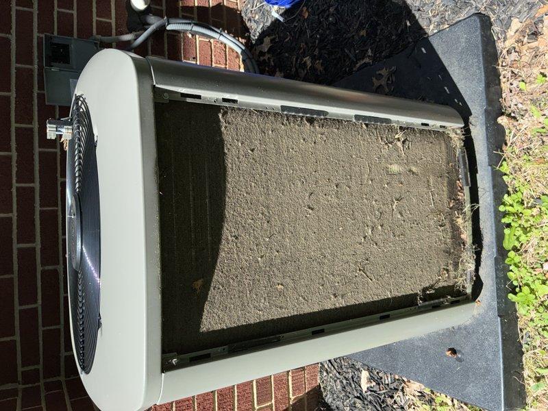 Completed routine maintenance on a 2-year-old residential air conditioning system as part of scheduled MVP cooling maintenance program. Upon arrival, contacted customer as requested before beginning work on the outdoor condensing unit. Inspection revealed heavily soiled condenser coil and filter surfaces with significant accumulation of dirt, dust, and debris that was restricting airflow and reducing system efficiency. Thoroughly cleaned condenser coils, removed built-up contamination from all external surfaces, and cleared surrounding area of debris. Verified proper refrigerant levels, checked electrical connections, and confirmed fan motor operation. System restored to optimal operating condition with improved airflow and heat transfer capability.