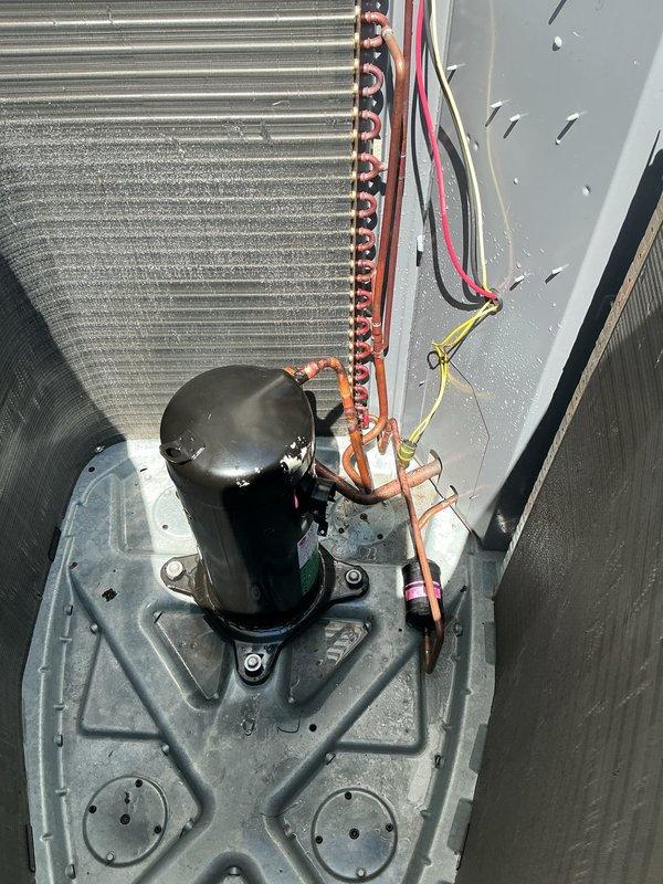 Replaced failed compressor on outdoor air conditioning unit. Removed defective compressor, installed new hermetically sealed replacement unit on equipment base pan, reconnected refrigerant lines and electrical connections, and restored system to proper operation.