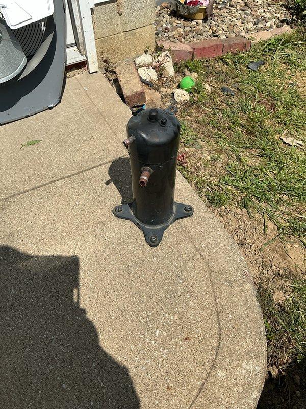 Replaced failed compressor on outdoor air conditioning unit. Removed defective compressor, installed new hermetically sealed replacement unit on equipment base pan, reconnected refrigerant lines and electrical connections, and restored system to proper operation.