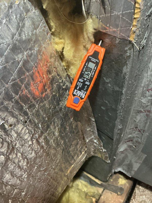 Responded to follow-up service call for recently installed A/C system with inadequate cooling performance. Performed diagnostic testing using digital multimeter to check electrical readings at air handler unit, inspecting internal components including blower assembly, wiring connections, and control circuits. Accessed unit interior by removing insulation to thoroughly examine motor housing, electrical connections, and verify proper system operation following previous technician's work.