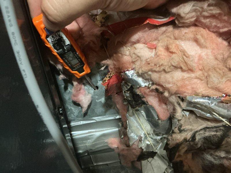 Responded to follow-up service call for recently installed A/C system with inadequate cooling performance. Performed diagnostic testing using digital multimeter to check electrical readings at air handler unit, inspecting internal components including blower assembly, wiring connections, and control circuits. Accessed unit interior by removing insulation to thoroughly examine motor housing, electrical connections, and verify proper system operation following previous technician's work.
