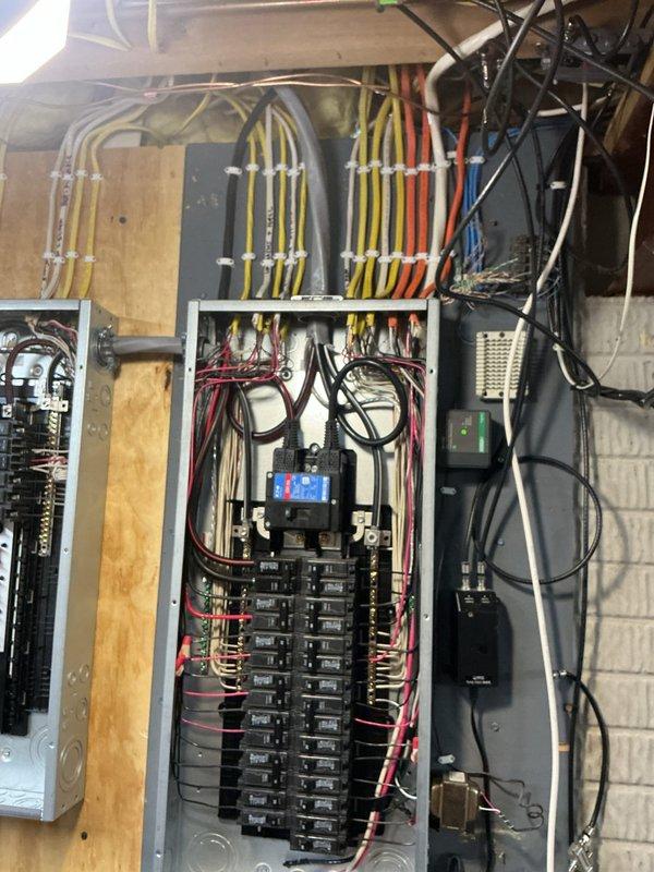 Completed a 150-amp electrical service upgrade with all necessary code updates to meet 2023 National Electrical Code requirements, including installation of an exterior disconnect. Installed whole home surge protection system with digital monitoring capability. Ran a new dedicated 20-amp circuit to the garage for refrigerator operation. Replaced six 3-way switches, two dimmer switches, and one fan control switch throughout the residence. Installed two new light fixtures—one in the sunroom and one in the first-floor hallway. Corrected the dishwasher circuit by reworking the connection and properly placing it on the correct leg of the multi-wire branch circuit to ensure balanced loading and safe operation. All electrical panels were mounted on wooden backing boards with proper wire management, featuring organized color-coded wiring and professional conduit installation. The upgraded system now includes multiple distribution panels with circuit breakers arranged for optimal circuit protec