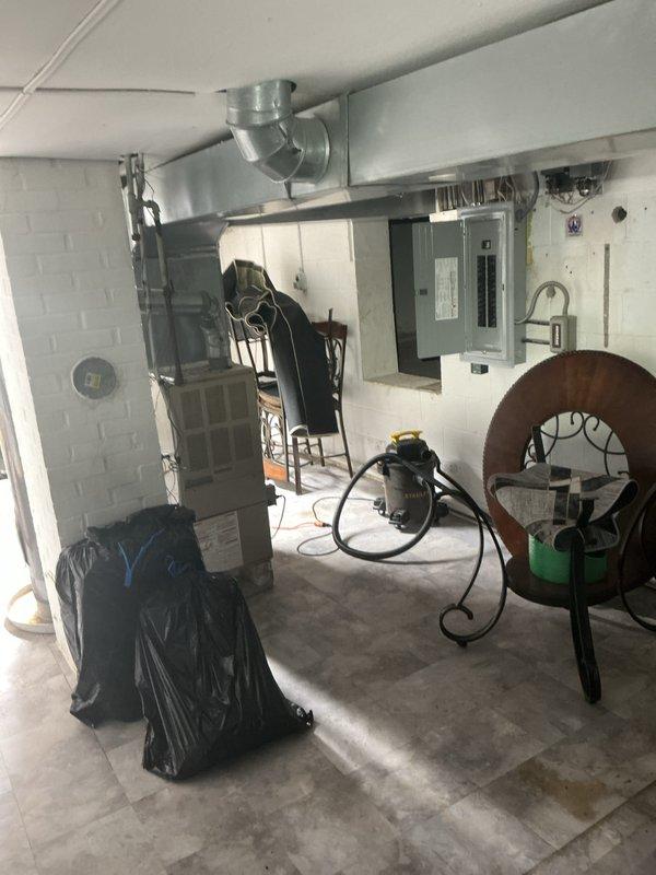 Completed installation of a 90% efficiency furnace system with new first-floor ductwork modifications. Installed one new supply duct and two new return air ducts on the first floor to improve airflow distribution and system performance. The new furnace unit was positioned in the basement utility area with proper venting and metallic ductwork connections extending to the ceiling distribution system. All ductwork was properly sealed and insulated with reflective material to maximize efficiency. System was tested and verified operational upon completion.