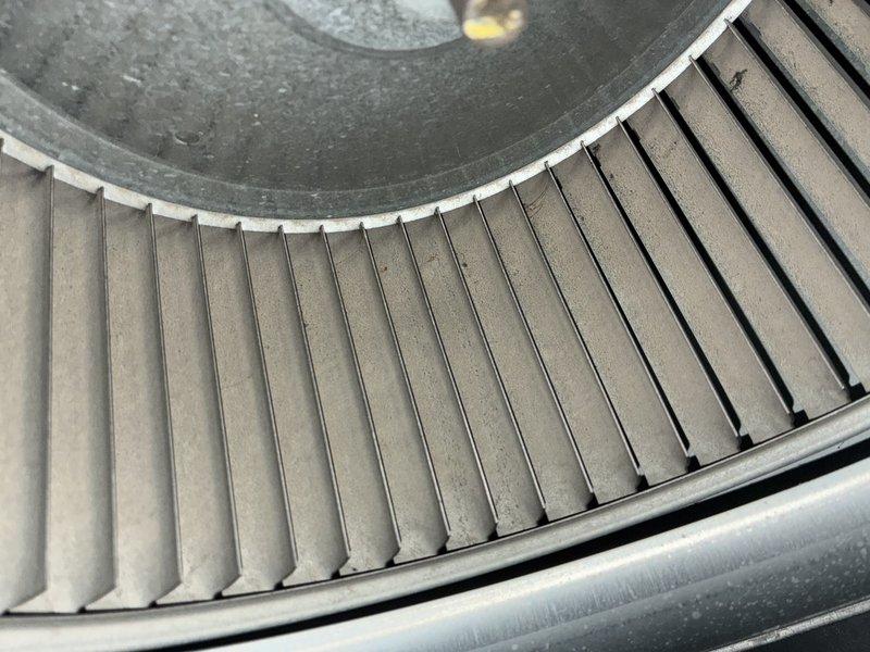 Completed preventive maintenance on a 5-year-old outdoor air conditioning unit. Inspected and documented the condition of the air handler's filtration system, noting dust accumulation on pleated filters, and examined the blower wheel assembly, which showed normal operational debris buildup on the squirrel cage fan blades. System components were assessed for proper operation and maintenance needs.