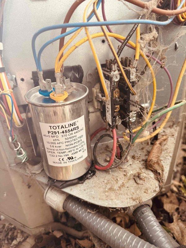 Responded to no cooling call on 10-year-old air conditioning system. Upon inspection, found failed dual-run capacitor with visible signs of age and deterioration. Replaced defective 45/5 MFD capacitor with new Totaline unit rated at 370/440 VAC. Verified all electrical connections, tested system operation, and confirmed unit returned to normal cooling function. Provided maintenance plan information via email for customer review.