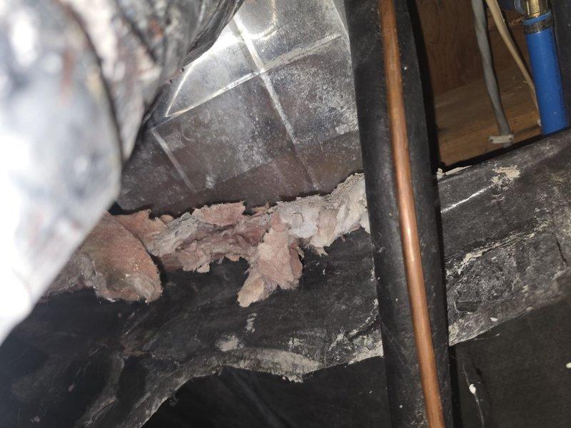 Returned to diagnose water splashing issue from evaporator coil into ventilation system. Upon inspection, found severely deteriorated insulation around ductwork and HVAC components in attic space, with material breakdown contributing to moisture management problems. Documented existing conditions showing compromised insulation integrity and recommended repairs to address both the water drainage concern and degraded insulation affecting system performance.