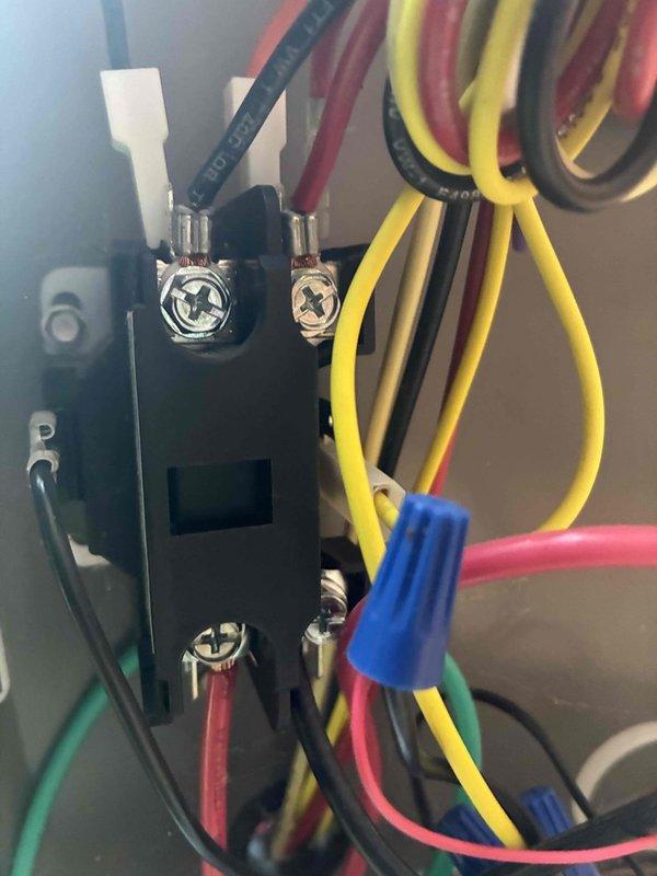 Completed routine cooling maintenance on a 2-year-old HVAC system. Inspected electrical connections, terminal blocks, and capacitor, verifying all wiring connections were secure and properly terminated. All components found in good working condition with no issues identified during the inspection.