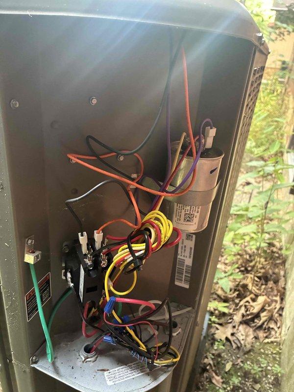 Completed routine cooling maintenance on a 2-year-old HVAC system. Inspected electrical connections, terminal blocks, and capacitor, verifying all wiring connections were secure and properly terminated. All components found in good working condition with no issues identified during the inspection.