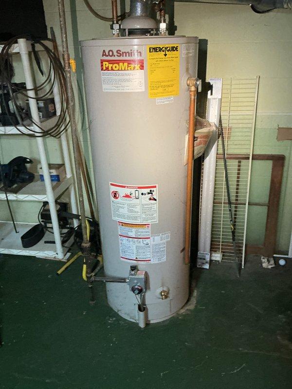 Conducted on-site assessment of existing conventional tank-style water heater for potential replacement with tankless system. Inspected current A.O. Smith ProMax storage tank water heater installation, documenting existing copper supply line configurations, venting arrangements, and utility room layout. Photographed current equipment condition, plumbing connections, and available space for equipment upgrade evaluation. Provided customer with comprehensive quote for tankless water heater installation including necessary modifications to gas line sizing, electrical requirements, and venting system reconfiguration.