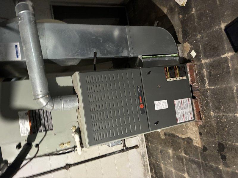 Completed MVP cooling maintenance visit on residential HVAC system aged 6-10 years with components located in basement and outside. Performed comprehensive inspection of air handler, condensing unit, refrigerant lines, and associated ductwork connections. System found operating within normal parameters with all mechanical and electrical components functioning properly. Verified proper airflow, checked refrigerant line connections for secure fittings, and documented equipment condition through photographic records for maintenance history.