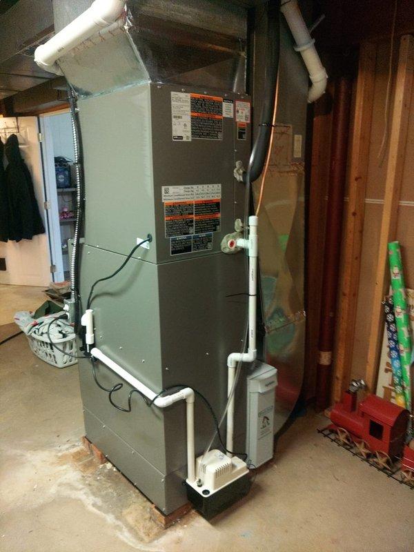 # HVAC Complete System Installation

Successfully installed a new 90% efficiency furnace with complete venting system in residential basement location. Installation included proper PVC flue piping configuration with vertical runs and connections for intake and exhaust venting. Mounted high airflow base platform under furnace unit to ensure proper clearance and airflow distribution. 

Installed condensate pump and drainage system at base of unit to handle moisture removal from high-efficiency operation. Completed all electrical connections with proper wiring and power supply integration. Secured furnace cabinet to structural framing with appropriate mounting hardware for stability and code compliance.

Performed system commissioning and testing using calibrated digital manifold gauges to verify proper refrigerant pressures and temperatures. Confirmed operational parameters including suction pressure at 43.7 psig, superheat readings, and subcooling values at 26.12°F. Verified heat exchan