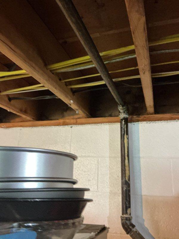 Repaired leaking gas main line in basement by cutting out compromised sections of the existing 1 1/2" trunk line and replacing with new 1" gas piping and fittings. Removed old connections, installed new piping sections with proper couplings, and secured all joints to code specifications to restore safe gas flow throughout the home.