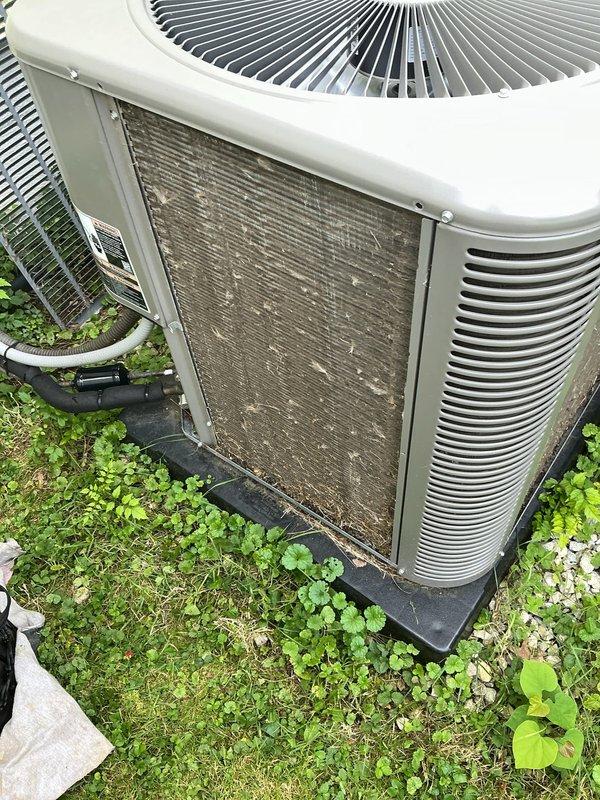 Performed comprehensive tune-up on one-year-old residential air conditioning system. Inspected outdoor condenser unit, noting accumulated debris on intake surfaces, and verified DiversiTech disconnect box installation and electrical connections. All components operating within normal parameters for unit age, with routine maintenance completed to ensure optimal system performance for cooling season.