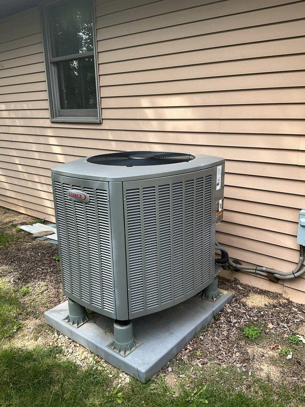 Completed comprehensive tune-up service on 5-year-old Lennox heat pump and furnace system. Performed full system inspection including outdoor heat pump unit positioned on concrete pad with proper elevation, verified all electrical connections and conduit routing along exterior wall, and inspected indoor furnace unit in basement with associated ductwork and PVC condensate drainage system. All components operating within manufacturer specifications, no deficiencies noted, and system ready for continued reliable operation.