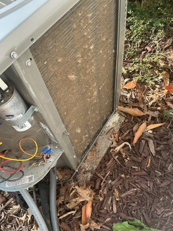 Completed scheduled maintenance on a 6-year-old cooling system, including inspection of both indoor air handler unit located in attic space and outdoor condenser unit. Performed standard preventive maintenance procedures, assessed system components and electrical connections, and documented equipment condition with photographic records showing heavily soiled outdoor filter requiring attention.