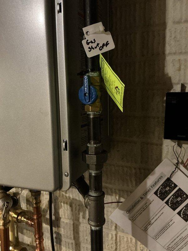 Performed routine preventative maintenance descaling service on Rinnai tankless water heater in 5-year-old residential property. Isolated unit using cold water shut-off valve, connected descaling pump to service valves, and circulated descaling solution through heat exchanger to remove mineral buildup and scale deposits. Flushed system thoroughly with clean water, verified all connections at copper and CPVC piping, checked expansion tank pressure, and confirmed proper operation of all isolation valves including red and blue-handled service valves. Unit restored to normal operation with no reported issues or symptoms prior to service.