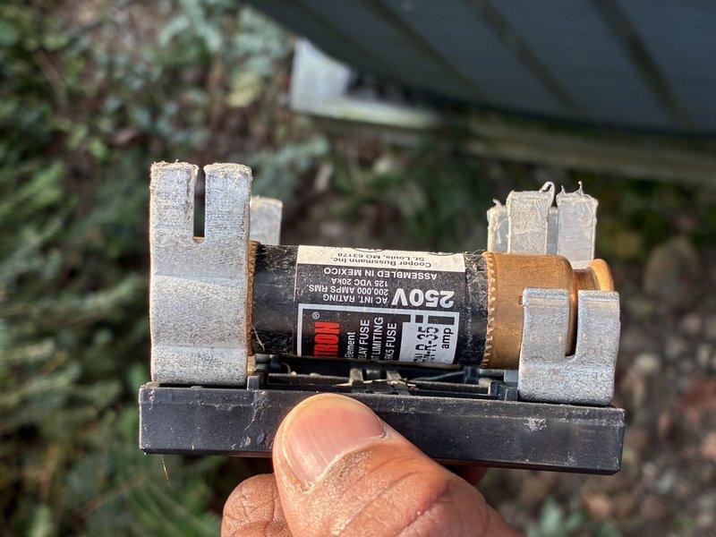 Performed routine cooling maintenance on an 18-year-old heat pump system. Conducted refrigerant pressure diagnostics using manifold gauges to verify system charge and operating pressures. Inspected and replaced a 35-amp, 250-volt fuse due to visible corrosion and discoloration at the contact points in the fuse holder, ensuring proper electrical protection for the unit.