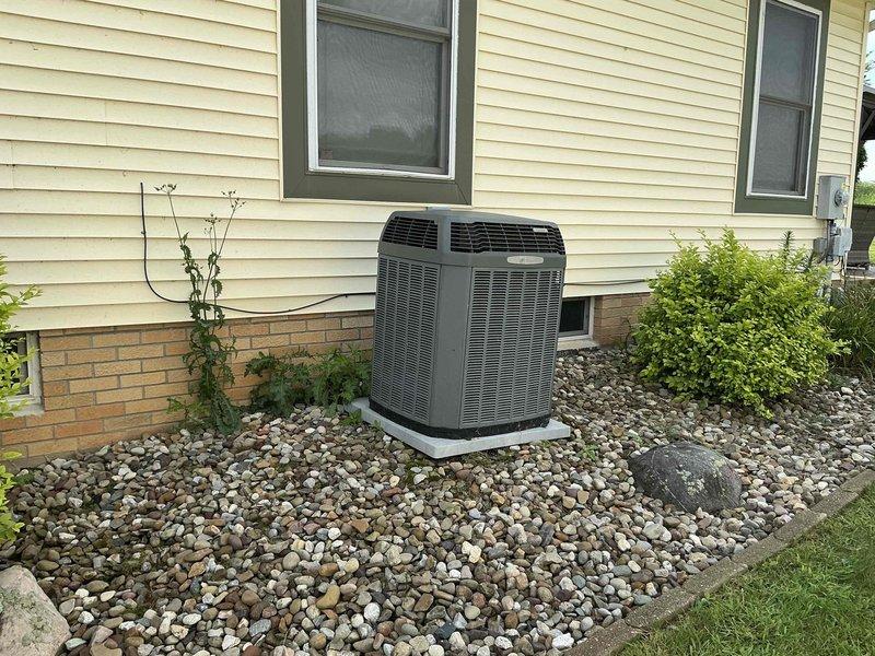 Completed comprehensive HVAC system replacement estimate for residential property. Evaluated existing outdoor condensing unit positioned on concrete pad with proper clearances and landscaping, as well as indoor air handler/furnace system with associated ductwork and drainage components in basement utility area. Assessment included review of current equipment condition, ductwork configuration, electrical connections, and condensate drainage system to provide replacement recommendations.