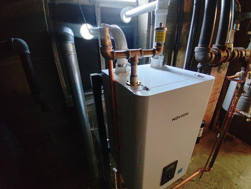 Completed full installation of Navien combi boiler unit in mechanical room with comprehensive copper piping connections and PVC venting system. Coordinated parts procurement from multiple suppliers and staged complete boiler kit with all necessary components. Resolved fitting compatibility issue on-site by implementing alternative connection solution for plumbing integration, successfully connecting unit to existing water heater and heating infrastructure with proper valve configurations and professional-grade copper work throughout.