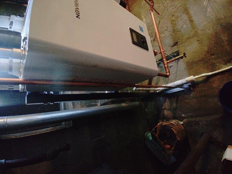 Completed full installation of Navien combi boiler unit in mechanical room with comprehensive copper piping connections and PVC venting system. Coordinated parts procurement from multiple suppliers and staged complete boiler kit with all necessary components. Resolved fitting compatibility issue on-site by implementing alternative connection solution for plumbing integration, successfully connecting unit to existing water heater and heating infrastructure with proper valve configurations and professional-grade copper work throughout.
