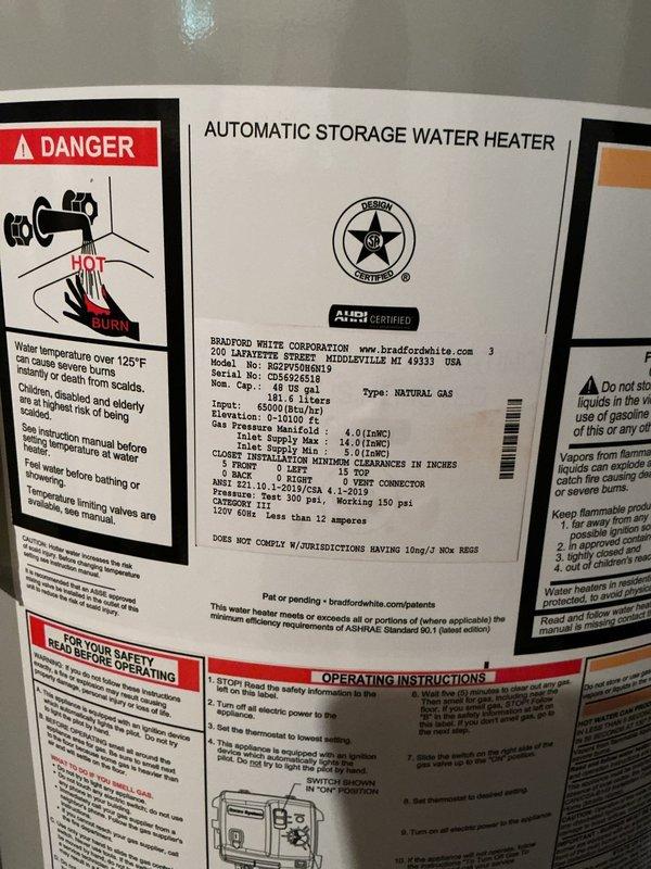 Removed and disposed of existing 50-gallon power vent water heater after shutting off gas and water supply and draining tank. Disconnected and preserved existing exhaust vent system for reuse. Installed customer-supplied 50-gallon Bradford White power vent water heater with new 3/4" water connections and replaced 1/2" gas union. Reconnected power vent exhaust system and reused existing 3/4" ball valve and bonding wire. Performed gas line leak test with all connections passing inspection. Filled tank, ignited burner, and set operating temperature to 120°F. Verified proper operation of all safety controls and venting system. One-year labor warranty provided on installation of customer-supplied equipment.