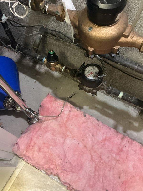 Responded to service call regarding potentially failing pressure reducer valve installed approximately one year prior. Upon inspection, assessed the pressure reducing valve assembly and associated plumbing components in the mechanical room, including examination of the pressure gauge readings and system performance. Evaluated the valve operation, checked for proper water pressure regulation, and inspected surrounding piping connections for any signs of malfunction or deterioration that could indicate valve failure.