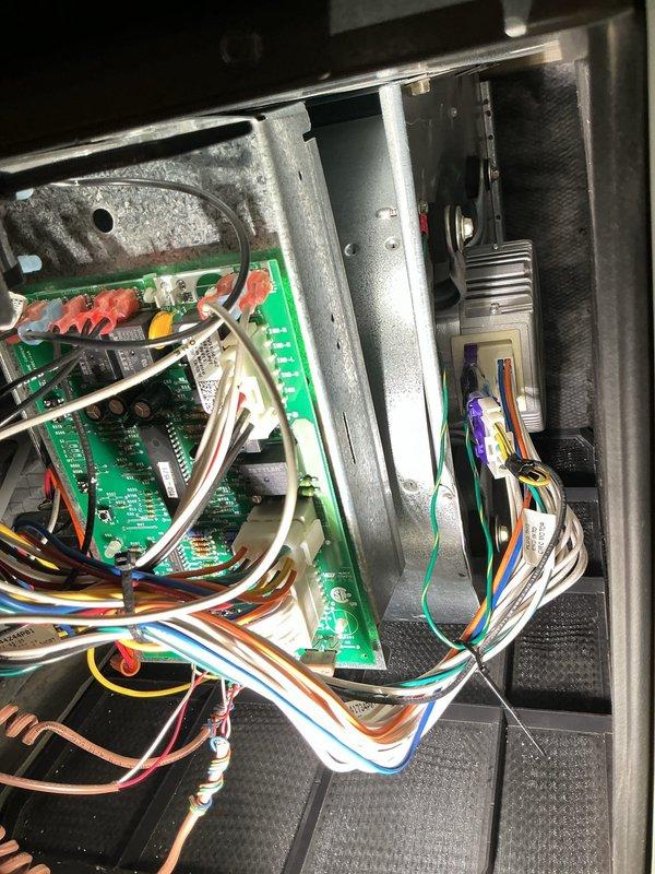 # HVAC Maintenance - Cooling

Performed comprehensive preventive maintenance on a 9-year-old air conditioning system. Conducted thorough inspection of outdoor disconnect panel, evaluating electrical connections, capacitors, and control components. Examined circuit board assembly and wiring harnesses within control housing, verifying proper connections and component integrity. Noted age-appropriate oxidation on copper terminals at disconnect panel connections. All electrical components functioning within normal parameters. System operational upon completion of maintenance service.