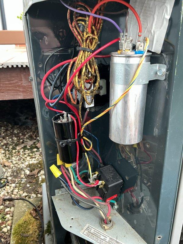 # HVAC Maintenance - Cooling

Performed comprehensive preventive maintenance on a 9-year-old air conditioning system. Conducted thorough inspection of outdoor disconnect panel, evaluating electrical connections, capacitors, and control components. Examined circuit board assembly and wiring harnesses within control housing, verifying proper connections and component integrity. Noted age-appropriate oxidation on copper terminals at disconnect panel connections. All electrical components functioning within normal parameters. System operational upon completion of maintenance service.