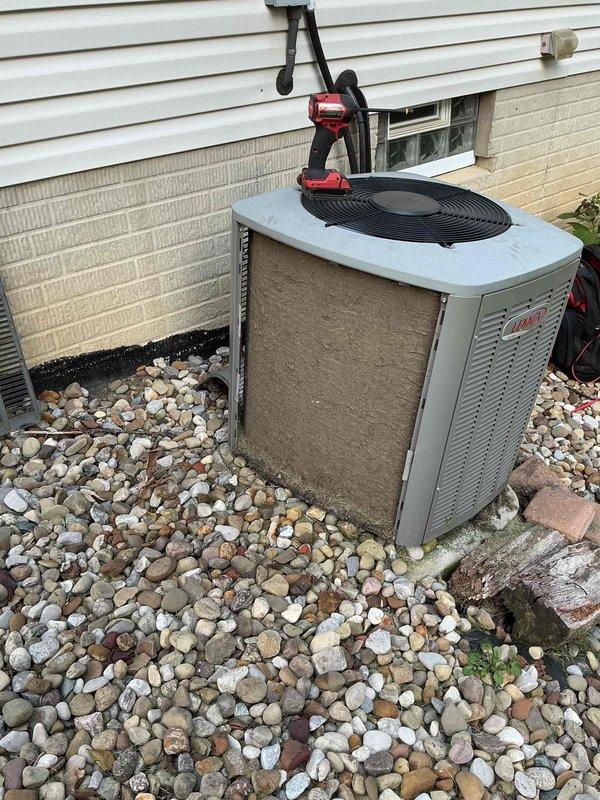Responded to service call for 10-year-old air conditioning system with complaint of unit running hotter than thermostat reading indicates. Upon arrival, performed diagnostic evaluation of outdoor condenser unit and indoor air handler components. Discovered severely clogged air filter with extensive dust, dirt, and debris accumulation restricting airflow throughout the system. Removed and replaced contaminated filter with new unit to restore proper air circulation and system efficiency. Inspected condenser unit exterior condition and verified operational status. The restricted airflow from the heavily soiled filter was determined to be the primary cause of temperature discrepancy between actual room temperature and thermostat display, as reduced air circulation prevented adequate heat exchange and cooling capacity.
