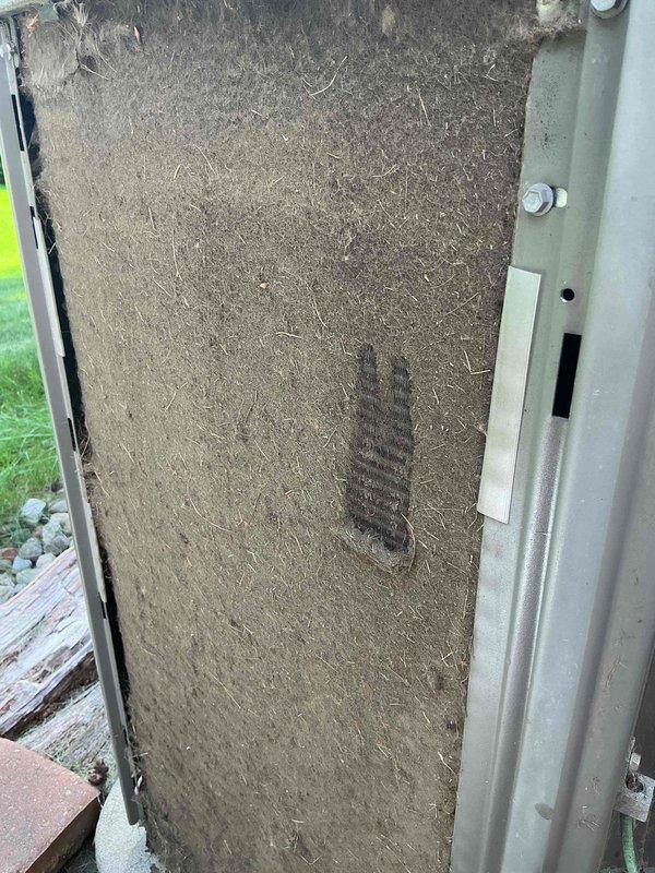 Responded to service call for 10-year-old air conditioning system with complaint of unit running hotter than thermostat reading indicates. Upon arrival, performed diagnostic evaluation of outdoor condenser unit and indoor air handler components. Discovered severely clogged air filter with extensive dust, dirt, and debris accumulation restricting airflow throughout the system. Removed and replaced contaminated filter with new unit to restore proper air circulation and system efficiency. Inspected condenser unit exterior condition and verified operational status. The restricted airflow from the heavily soiled filter was determined to be the primary cause of temperature discrepancy between actual room temperature and thermostat display, as reduced air circulation prevented adequate heat exchange and cooling capacity.