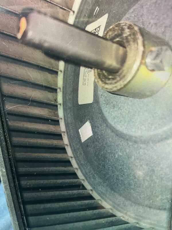 Completed routine maintenance visit on 7-year-old air conditioning system. Performed standard cooling season inspection including examination of blower motor assembly and electrical components. Inspected blower wheel, which showed dust accumulation on fins and surfaces. Evaluated capacitor and associated wiring connections, verifying proper electrical terminations and component mounting. Provided pricing information for coil cleaning service as requested.
