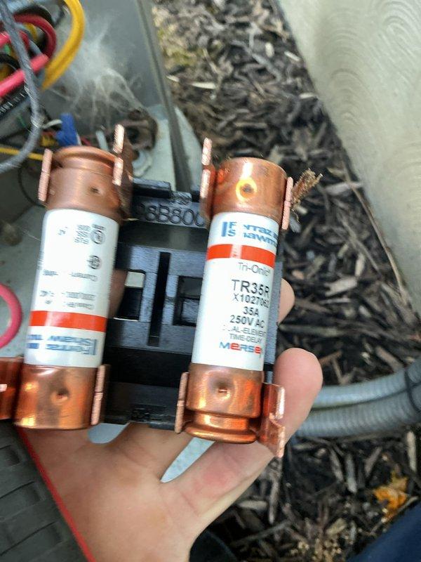 Completed scheduled cooling maintenance on 5-6 year old residential air conditioning system. Inspected and replaced two TR359 35A 250V fuses in electrical disconnect, cleaned debris from condenser unit exterior and surrounding area, and verified proper system operation. Unit showed normal wear consistent with age and outdoor exposure.