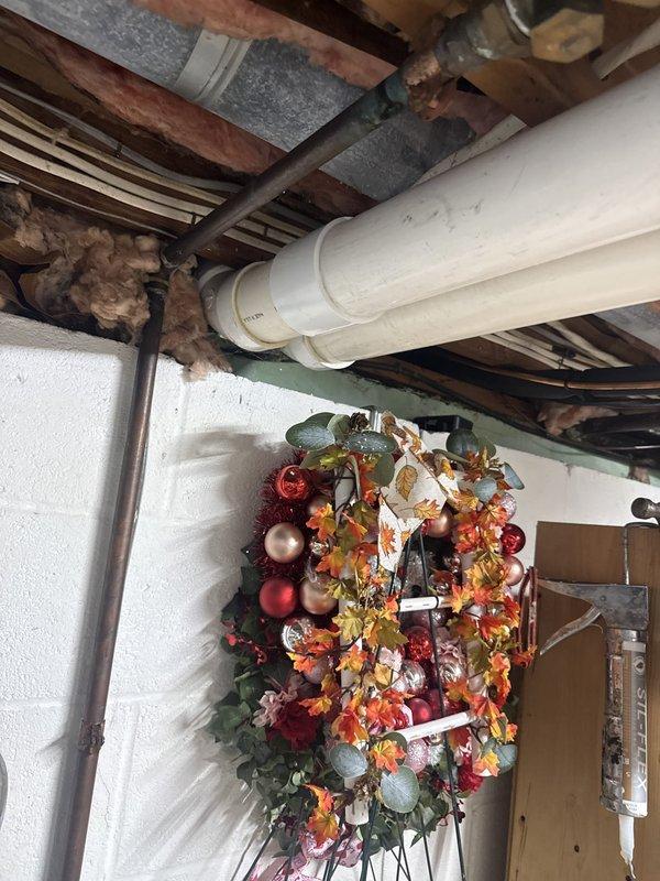 Failed initial inspection due to non-code-compliant cellular core piping installed on furnace exhaust run. Air conditioning system and carbon monoxide detector were properly installed to code. Job placed on hold pending approval for replacement of exhaust piping with code-approved PVC venting system, with scheduling to be coordinated for completion.