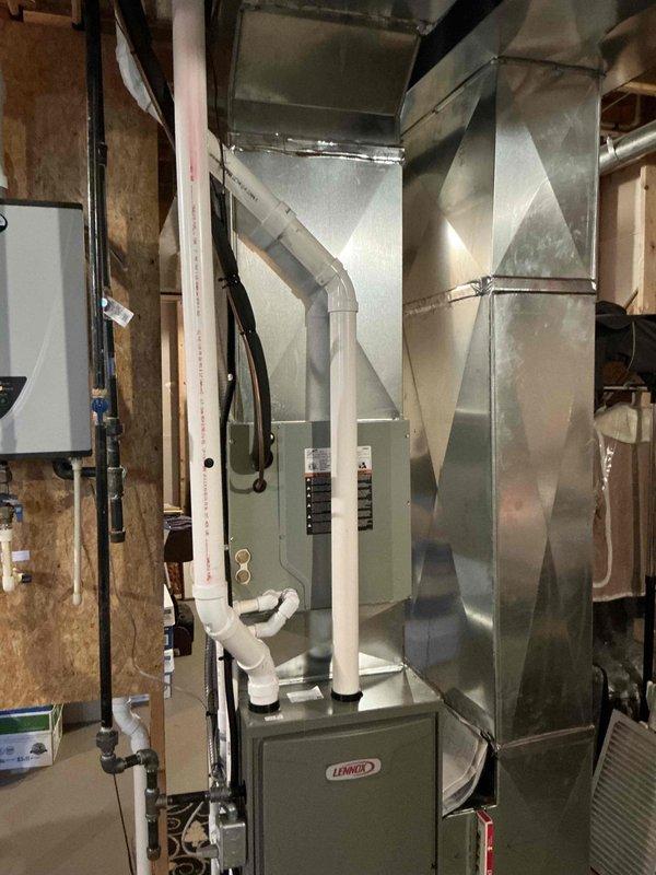 Conducted comprehensive HVAC system evaluation for 12-year-old residential unit experiencing refrigerant leak and potential expansion valve malfunction. Assessed Lennox furnace system with associated ductwork in basement utility area and exterior condenser unit, documented existing equipment condition, and provided replacement estimate for complete system upgrade to address coolant loss and component failure issues.