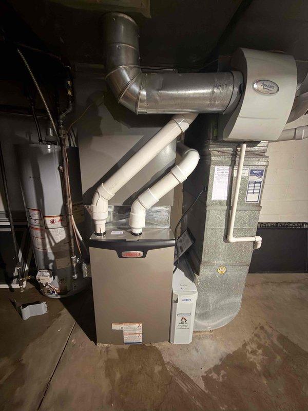 Completed installation of new flue piping for existing 90% efficiency furnace system as warranty follow-up work. Installed proper PVC venting components, secured all connections, and verified carbon monoxide detector placement for safe operation.