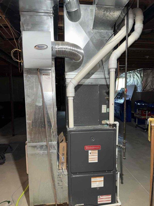 Completed comprehensive estimate for residential HVAC zoning system installation to existing Goodman furnace and ductwork infrastructure in basement location. Documented current equipment configuration including air purification unit, ductwork layout, and mechanical systems to develop zoning solution proposal for enhanced climate control throughout the home.