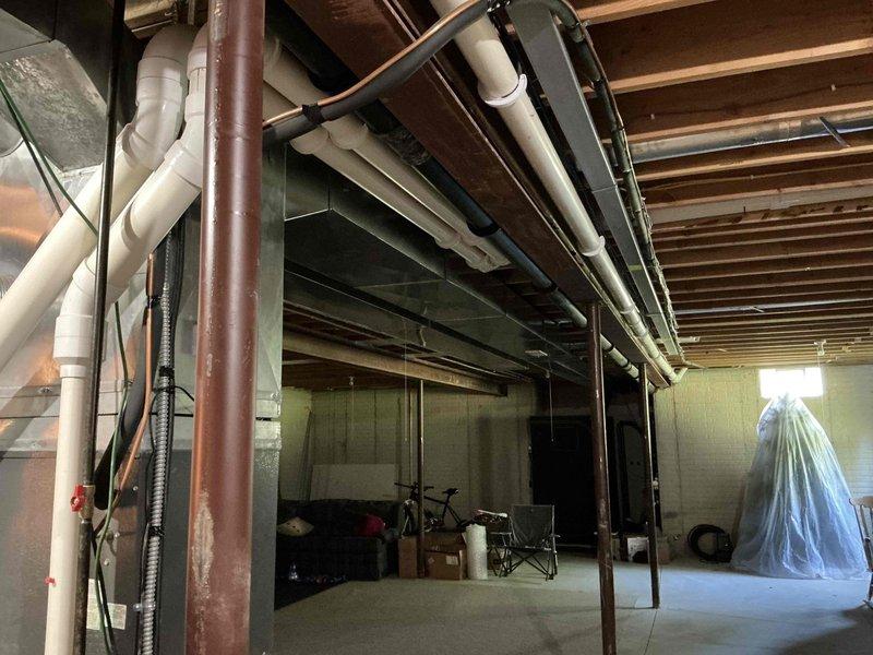Completed comprehensive estimate for residential HVAC zoning system installation to existing Goodman furnace and ductwork infrastructure in basement location. Documented current equipment configuration including air purification unit, ductwork layout, and mechanical systems to develop zoning solution proposal for enhanced climate control throughout the home.