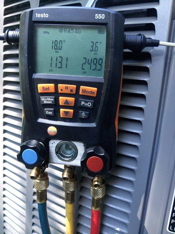 Completed installation of two air conditioning units with coil assemblies. Replaced electrical fuse block with new FLNR 40-amp fuses and verified proper electrical connections. Performed system startup and diagnostics using Testo 550 digital manifold gauge, confirming proper refrigerant pressures and temperatures across both systems.