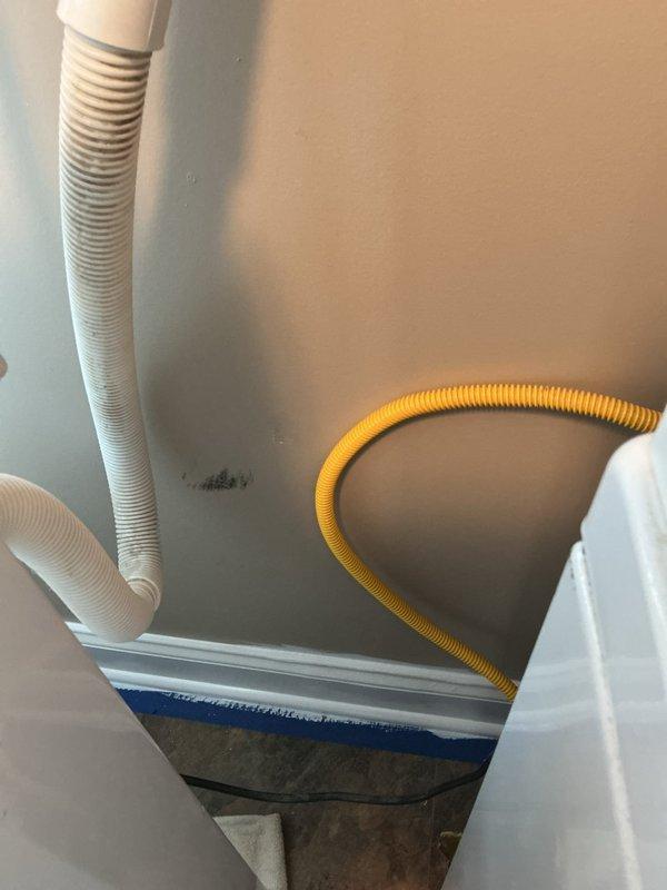 Responded to clogged drain issue at washing machine location where suds were backing up through the drain and overflowing down the wall. Inspected drainage system including standpipe and associated plumbing connections in the mechanical room area. Cleared obstruction from washing machine drain line to restore proper drainage and eliminate backup condition.