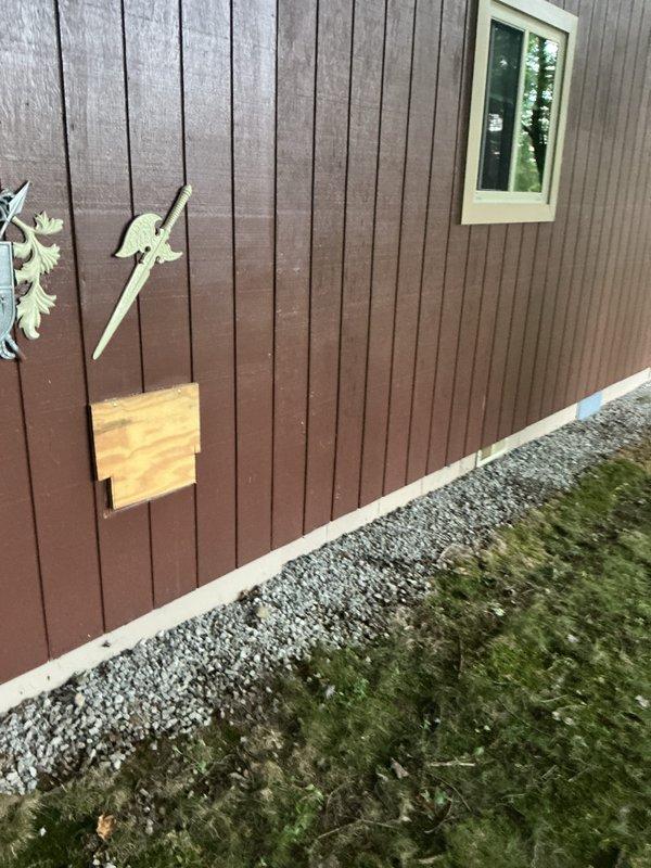 Completed installation of dehumidifier unit and wall-mounted heater in residential structure with rustic interior finishes. Unit currently configured for natural gas operation with notation that propane conversion will be required at future date per customer request.