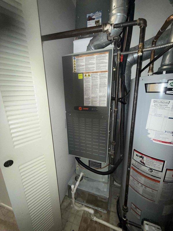 Completed BS-MVP cooling maintenance visit on 14-year-old residential HVAC system. Performed comprehensive inspection of Trane air handler unit located in interior mechanical closet and outdoor condenser unit. Inspected all refrigerant lines, electrical connections, ductwork, and condensate drainage system. Verified proper airflow through louvered condenser panels and checked fan operation. Examined gas line connections and mounting stability of equipment. System operating within normal parameters upon completion of maintenance protocol.