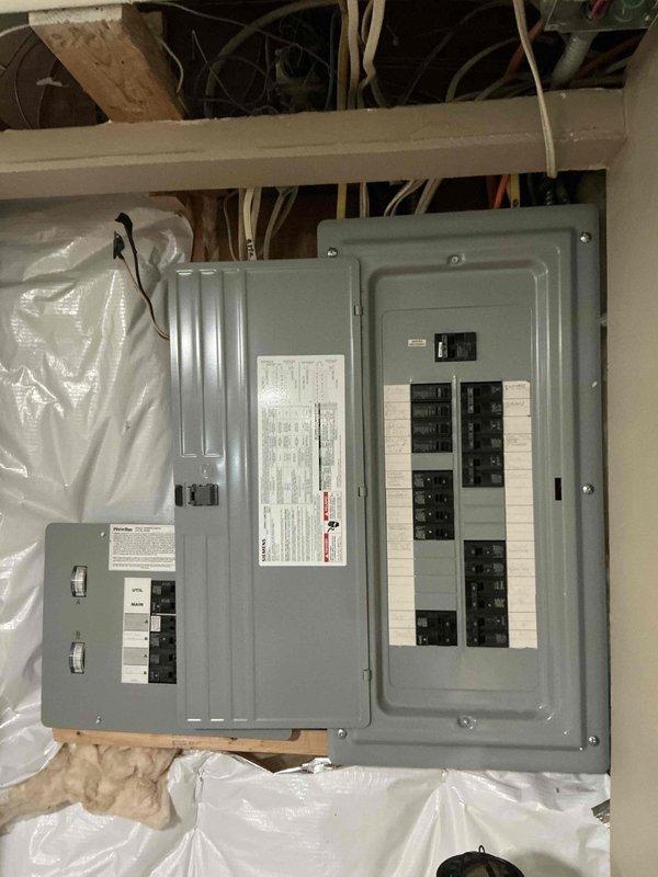 Conducted on-site evaluation for generator replacement at residential property. Existing generator requires replacement, with home already equipped with proper transfer switch and electrical infrastructure for generator operation. Assessed electrical panels, circuit breaker configuration, and existing wiring to confirm compatibility with new generator installation. Documented current electrical setup including main service panels and transfer switch arrangement. Identified gas line routing in basement ceiling area for coordination with generator fuel supply requirements. Photographed existing electrical panel configuration and utility infrastructure to support accurate estimate preparation for complete generator replacement.