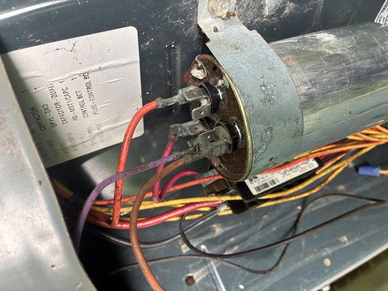 Completed preventive maintenance on 13-year-old air conditioning system. Performed electrical diagnostics using clamp meter, recording amperage readings at 83.7 amps. Inspected condenser unit components including compressor motor, capacitor, and electrical connections, noting age-appropriate wear and some corrosion on motor terminals but system operating within acceptable parameters.