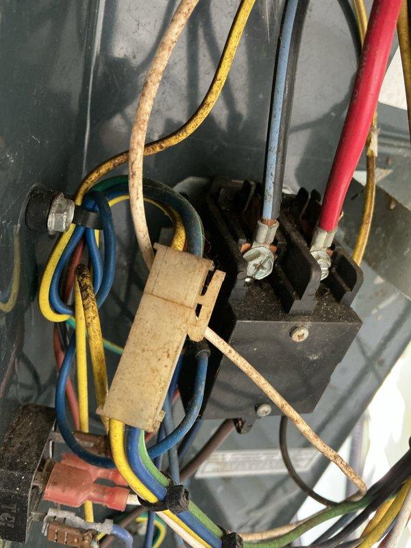 Responded to no cooling/no airflow complaint on 15-year-old air conditioning system. Upon inspection, found failed blower motor capacitor with significant corrosion and deterioration at terminals. Replaced defective capacitor, verified proper electrical connections, and tested system operation. Unit restored to normal cooling function with proper airflow throughout.
