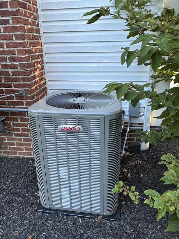 Performed preventative maintenance cooling visit on 3-year-old Lennox residential air conditioning system. Inspected outdoor condenser unit and indoor furnace/air handler system, verified proper operation of all components, and documented equipment condition with photos showing units in clean, well-maintained operational status.