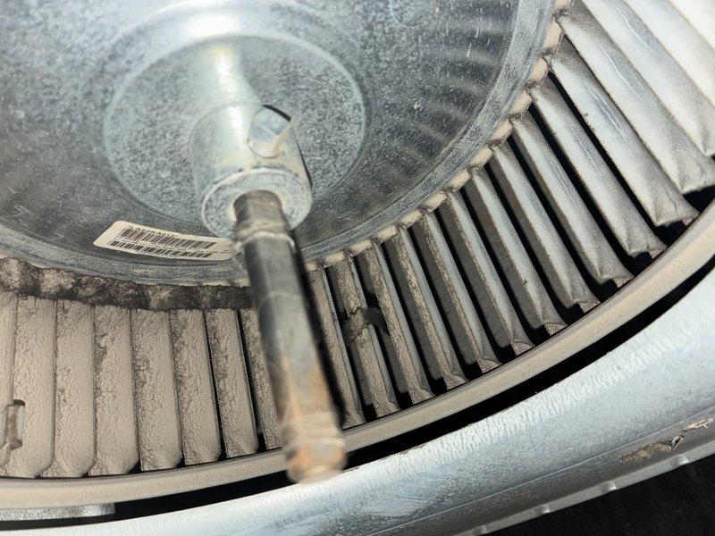Completed annual maintenance on 12-year-old residential air conditioning system. Inspected outdoor condenser unit and indoor blower assembly, noting significant dust and debris accumulation on squirrel cage blower wheel blades requiring cleaning for optimal airflow and system efficiency. Performed standard preventive maintenance procedures to ensure proper cooling system operation.