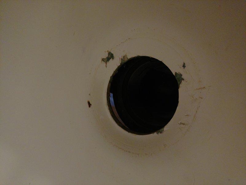 Cut access point in kitchen/dining room ceiling to reach bathtub drain line. Removed defective drain connection and installed new drain line with proper waste and overflow assembly. Replaced improper P-trap with code-compliant trap configuration. Tested all connections for leaks and verified proper drainage function upon completion.
