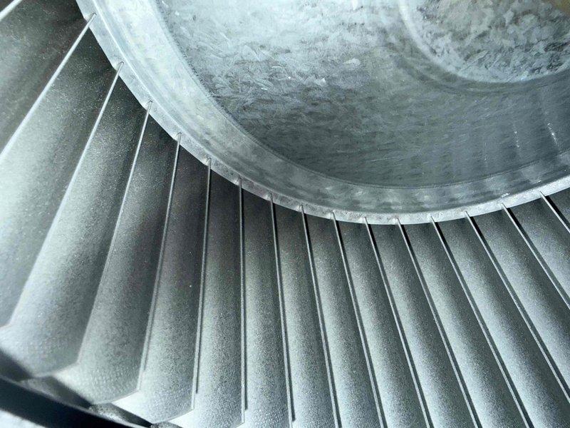 Completed scheduled MVP heating maintenance visit on residential HVAC system. Performed thorough inspection of blower assembly, revealing normal operational wear with dust and particulate accumulation on turbine fan blades and central hub area. Inspected control board and verified proper configuration of DIP switch settings and indoor discharge air sensor connections. All components functioning within normal parameters. System operational upon completion of maintenance inspection.